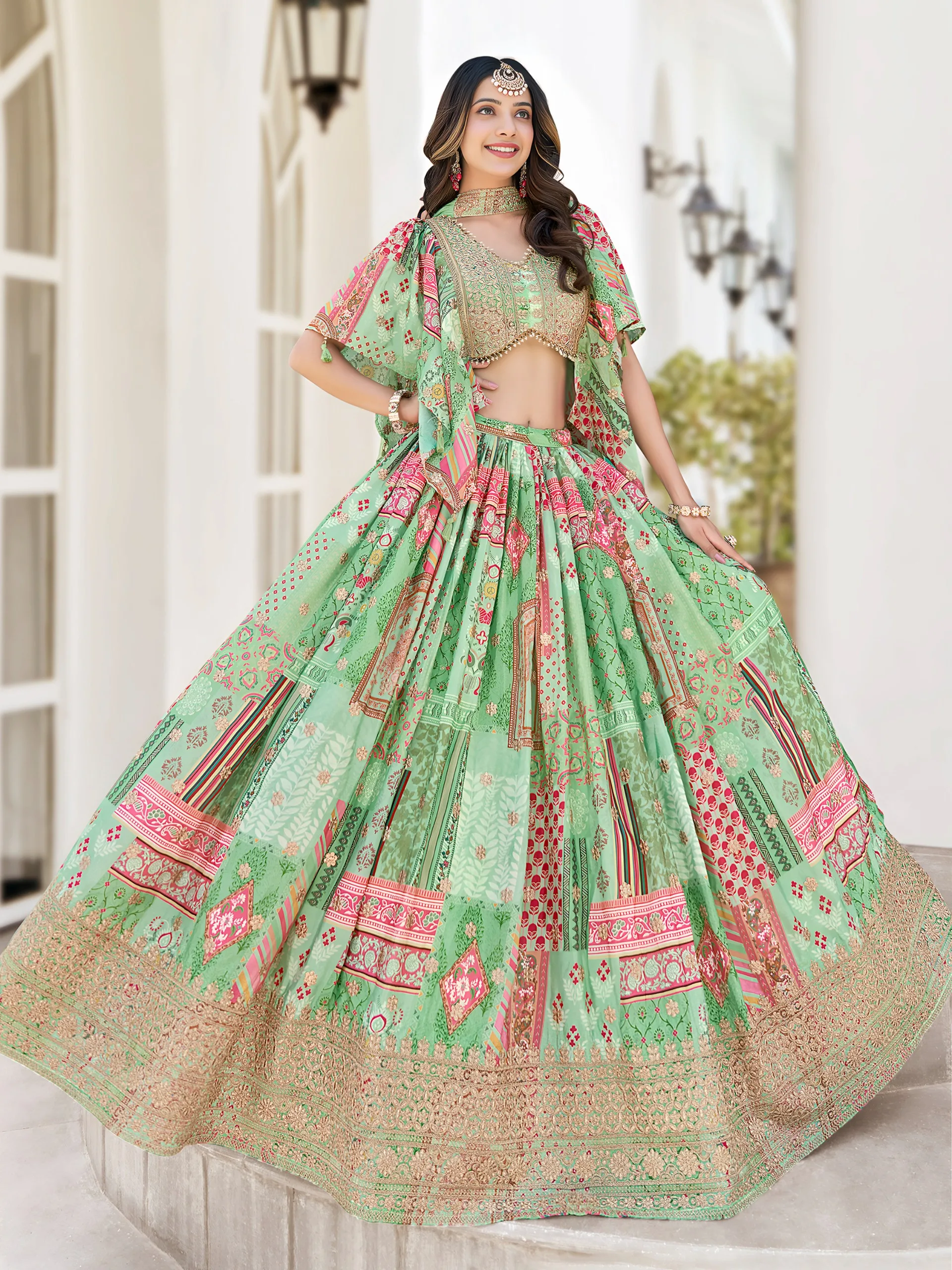 Woman in pastel green multicolor embroidered lehenga with zari border, pearl-detailed blouse, and choker-style dupatta – perfect for weddings and festivals.