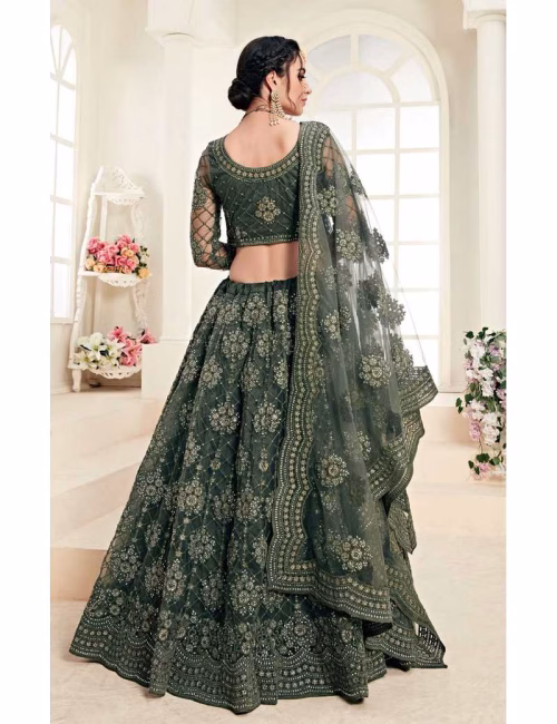Back view of the Voguevive green lehenga showing the scoop neck blouse design and dupatta drape.